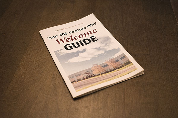 a booklet on a wooden table